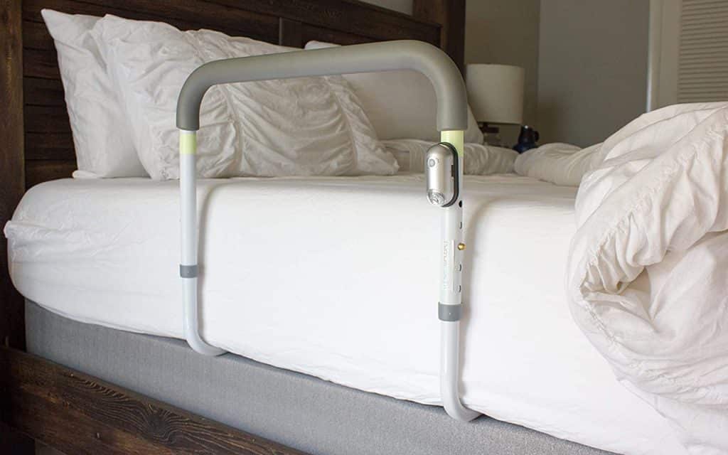 bed rail under mattress across on floor